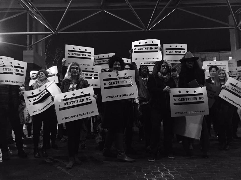 Artists and community members hold a demonstration outside of the DC Zoning Commission’s hearing on the sale of the Union Arts building, home to Mousai House and dozens of other arts spaces.