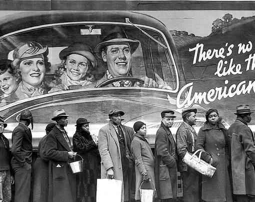 Line of African Americans under billboard picturing smiling happy white people, with text reading "There's no way like the American way"