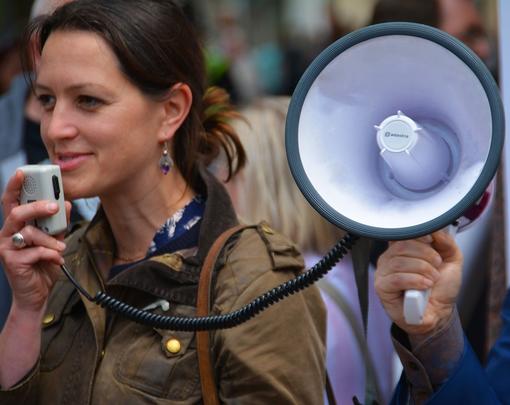 A woman holding a megaphone