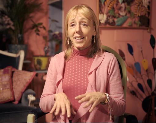 A picture of Medea Benjamin, wearing pink.