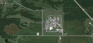 An aerial view of a civil commitment facility, surrounded by sparsely populated rural land.