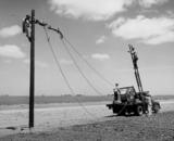Rural Electrification Administration erects telephone lines in rural areas.