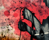 job guarantee abstract art image A silhouette of person cutting wires frames an image of a set of wrenches. The background appears to be a damaged industrial setting, a concrete wall with pink splotches.
