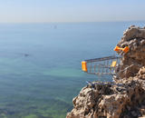Shopping Cart Perched on Cliff