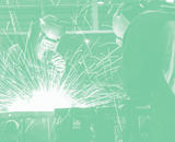Workers welding, with exciting sparks flying!