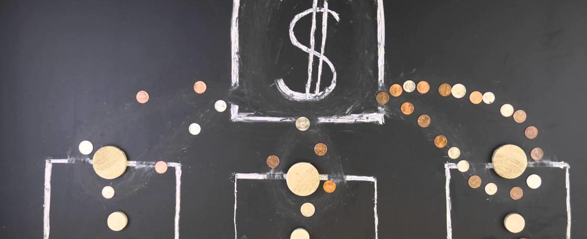 A picture of money moving schematically on a chalkboard to indicate the concentration of wealth in a financial institution.