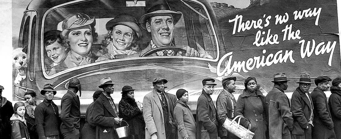 Line of African Americans under billboard picturing smiling happy white people, with text reading "There's no way like the American way"