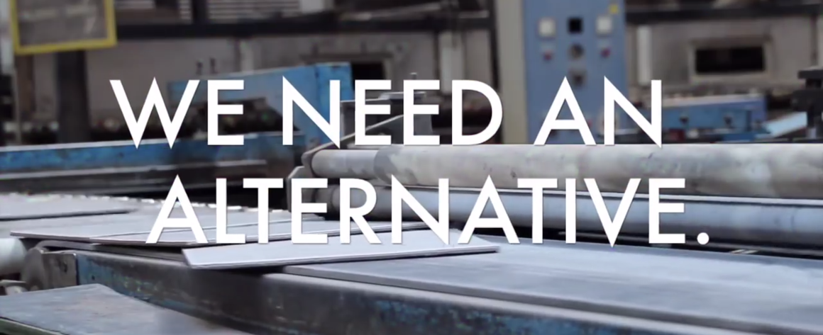 "We Need An Alternative", on top of an image of a factory.