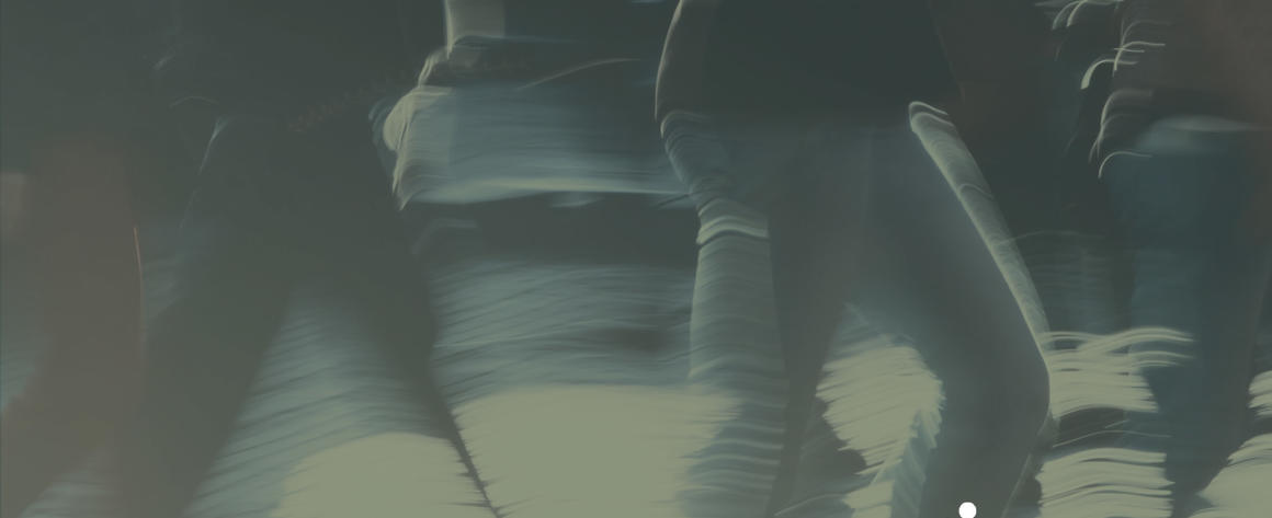 Blurred people walking in the same direction