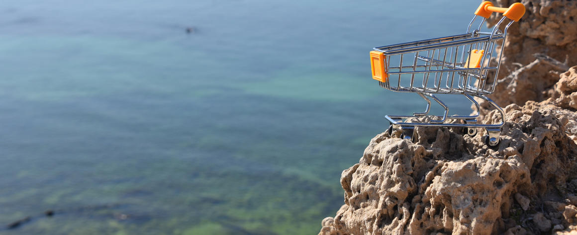 Shopping Cart Perched on Cliff